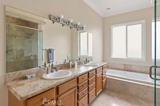 Master Bathroom, lots of vanity storage, oversized bath tub and separate shower