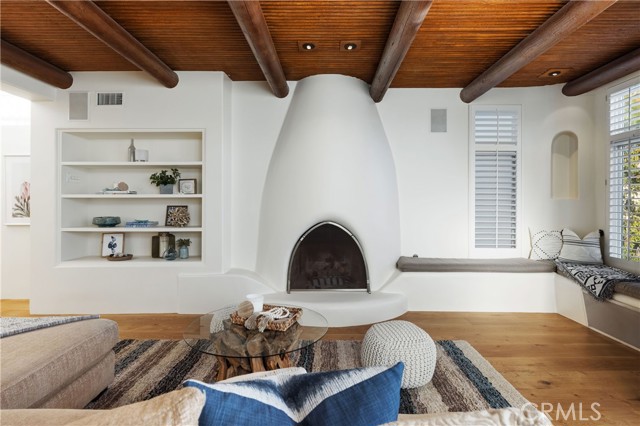 Living room with fireplace and seating area in second floor.