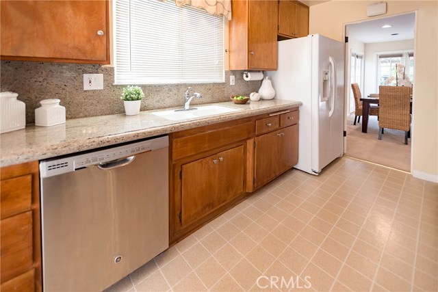 Kitchen with Granite Counters and Stainless Dishwasher