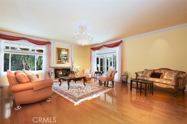 Living Room with Marble Fireplace & Crystal Chandelier