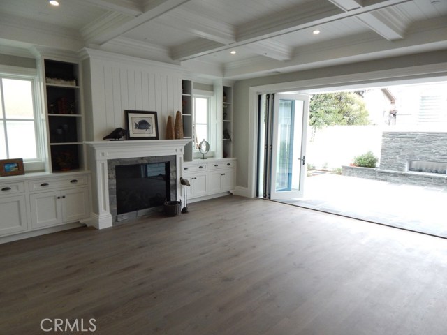 Huge Family Room with Manifold Doors Opening to Backyard