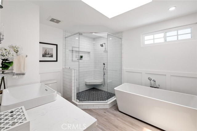 Completely remodeled master bathroom with quartz countertops and walk in shower.