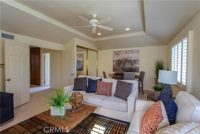 Spacious Bonus Room with built-in cabinetry in closet and quality plantation shutters.