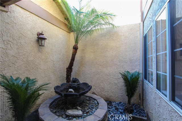 Charming atrium off of Master Bath and Foyer.