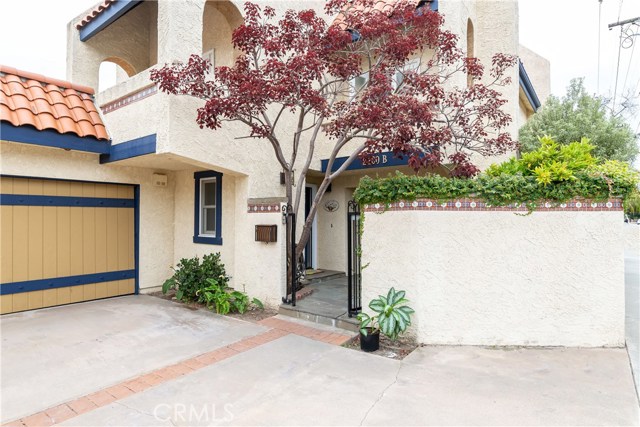 Gated entry leads to the private courtyard.