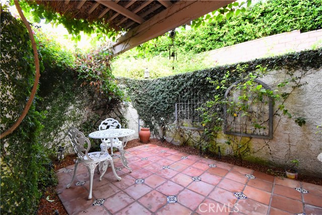 Private, quaint patio off of bedroom #2 on first level