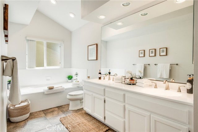 The en suite main bathroom has double sinks, a separate shower and a large jetted tub.