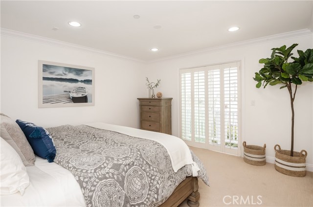 Primary bedroom faces west for lots of light and ocean peak plus sunset views.