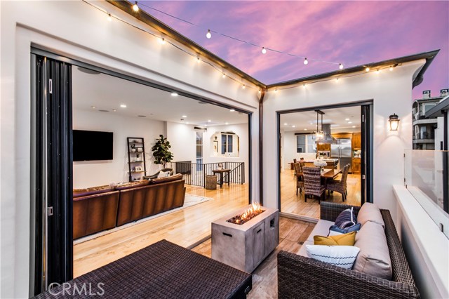 Panoramic doors open the living space up to the outdoor deck.