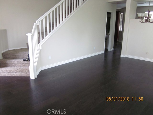 View of stairs entry from living room.