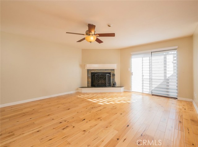 Spacious living room with fireplace.