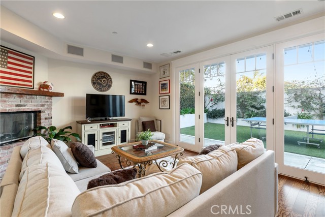 Family Room on the lower level provides a separate space for relaxing and access to rear yard