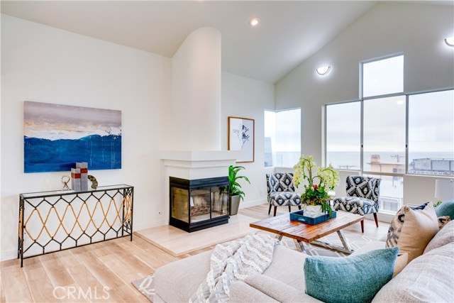 New wood finished laminate floors span the upper level and freshly painted walls reach sky high