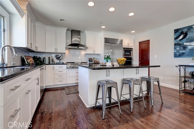 Gourmet chef's kitchen includes newer shaker cabinets, crown molding and Subway Tile backsplash.