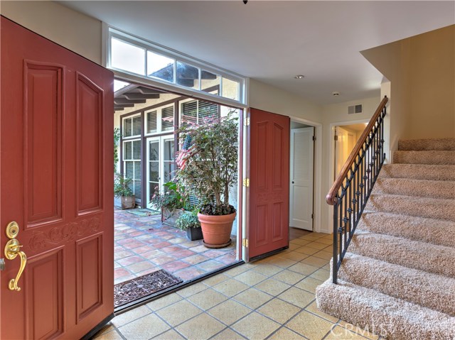 Grand double door entry from courtyard