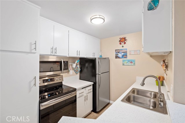 Newly remodeled kitchen with stainless steel appliances.  Easy to clean electric stove.