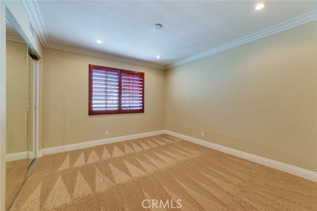 Upstairs bedroom with mirrored wardrobe doors