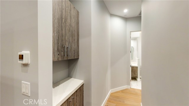 HALL WAY WITH STORAGE LEADING TO BATH AND 4TH BEDROOM
