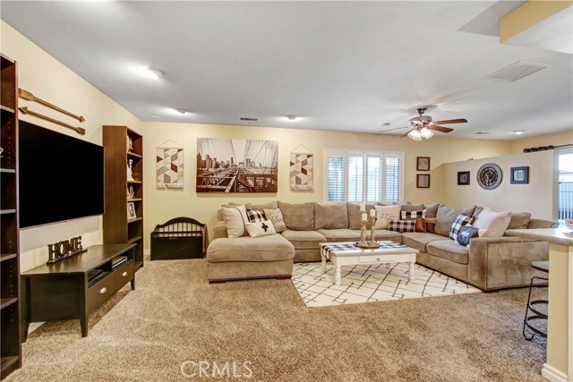 Beautiful and large, this family room is perfect for any family or entertaining guests.  Open to the kitchen, office, and access to the patio and pool area.