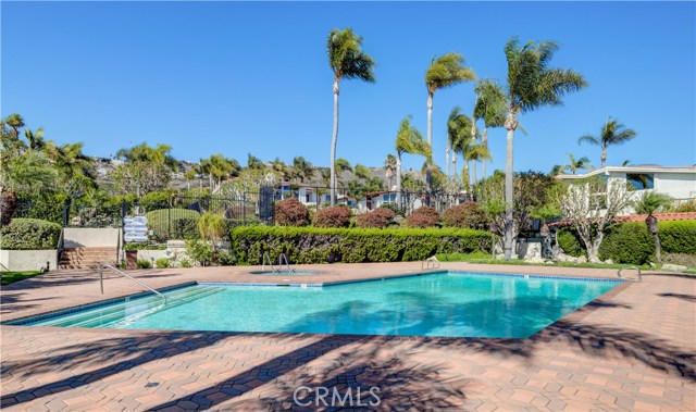 To the right is a building with 2 bathrooms for the pool.