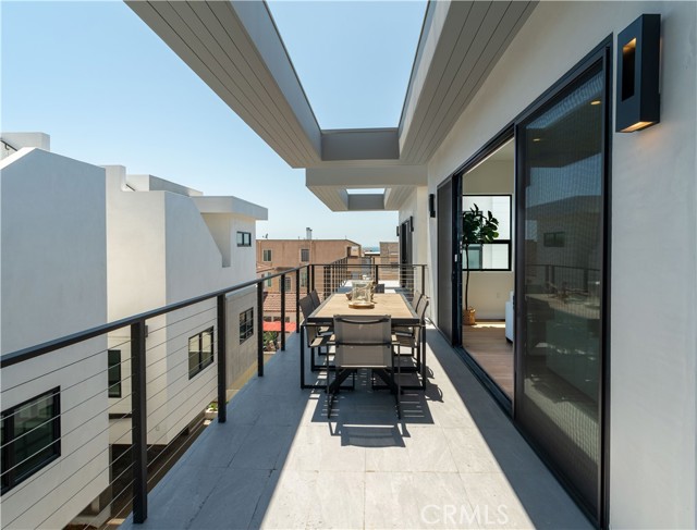 Enjoy the ocean breezes on the Living Room Balcony