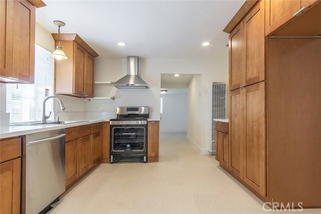 Recently remodeled kitchen with new cabinets, appliances, light fixtures, and counter tops.