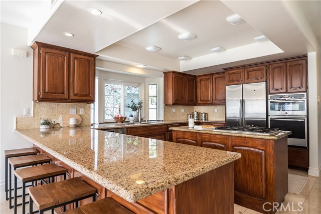 Kitchen with island and sit-at counter