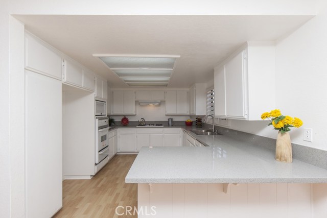 Breakfast counter between kitchen and dining room.