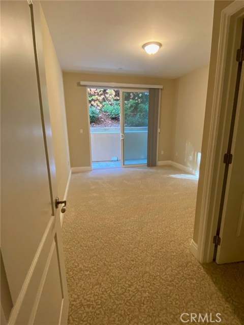 Second Bedroom with New Plush Carpets. It has a Separate Sllding Glass Door to Backyard.