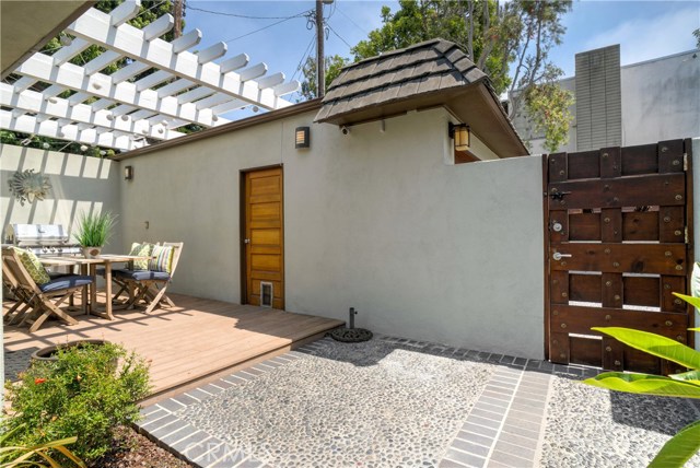 Courtyard, pergola and garage view from front door.