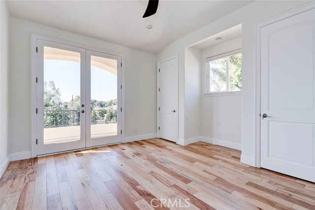 Upstairs bedroom with balcony overlooking Greenbelt