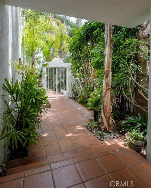 Through your locking gate down a peaceful walkway to your front door.