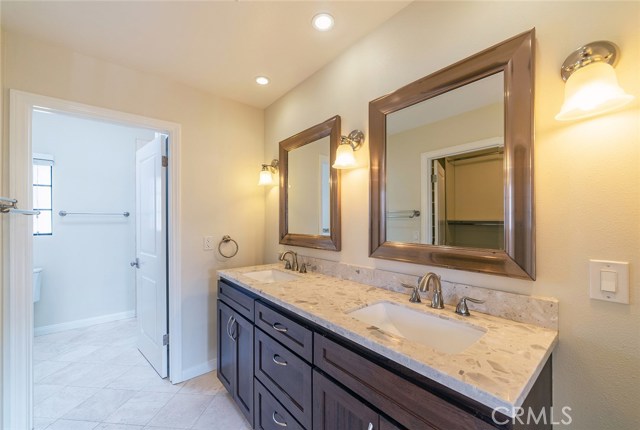 En suite master bathroom has double vanity.