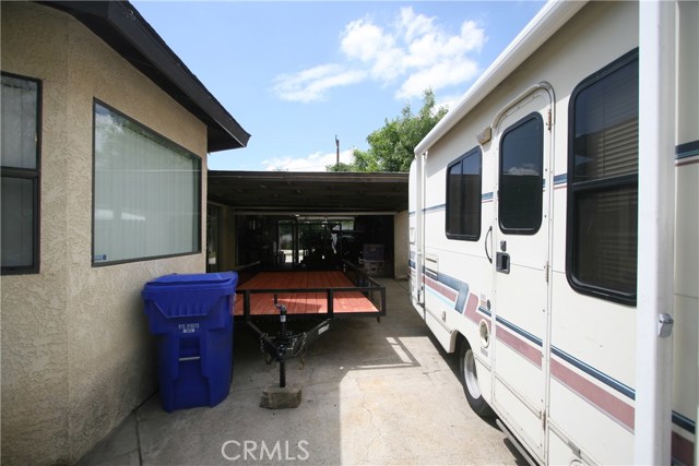 Drive thru 2 car garage with doors at each end and a very long driveway provides lots of parking spaces.