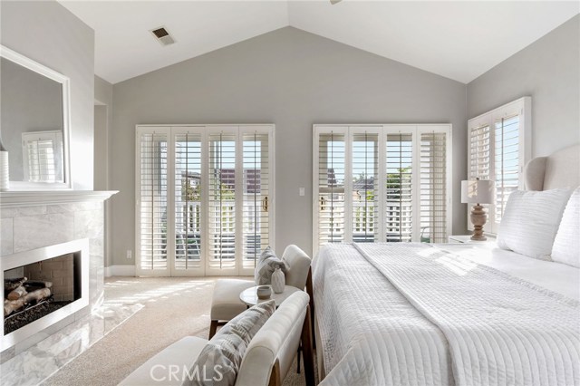 Primary Bedroom with Plantation Shuttered French Sliders to Balcony