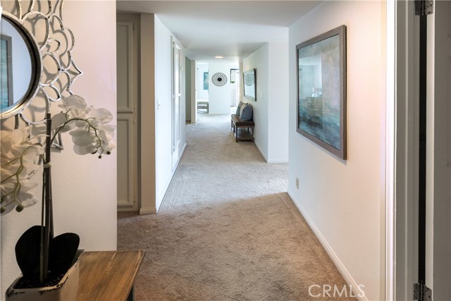 Entry Way into the condominium with Living Room down the hall to the right and Family Room to the left.