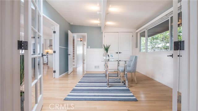 Bedroom/office with new lighting, window and window coverings