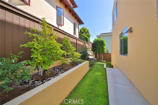 side yard with nice landscaping