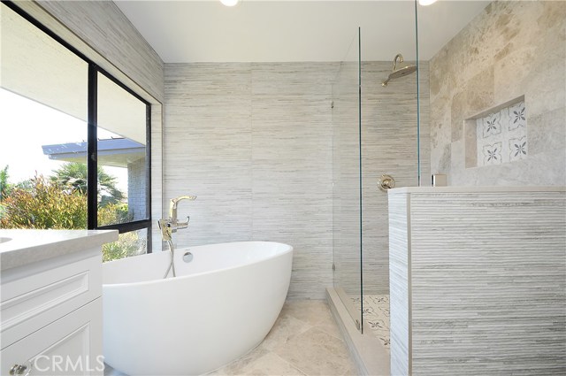 Master bathroom with separate bathtub and shower