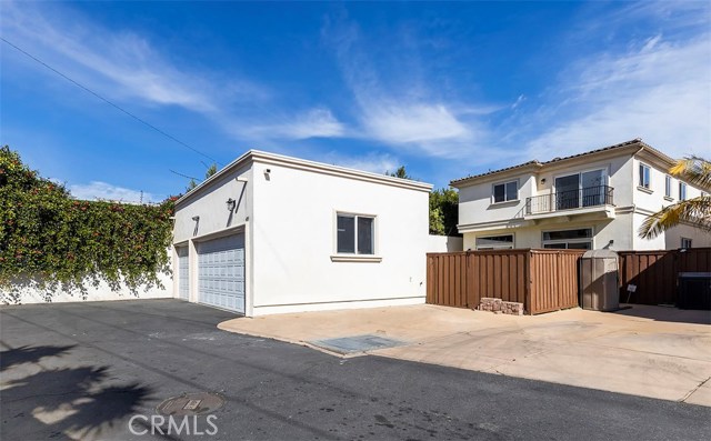 Three car garage and alley parking