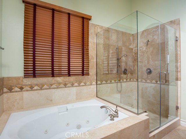 Master bath has jacuzzi tub and separate shower with dual shower heads.