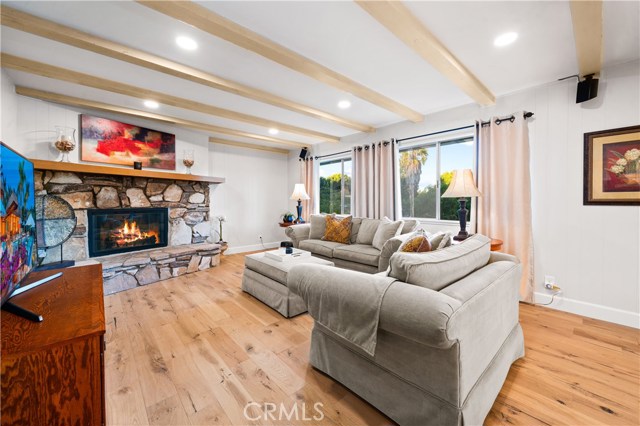 Family room with great views of mature trees and hills.
