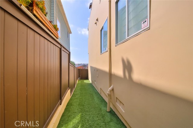 side yard with synthetic turf