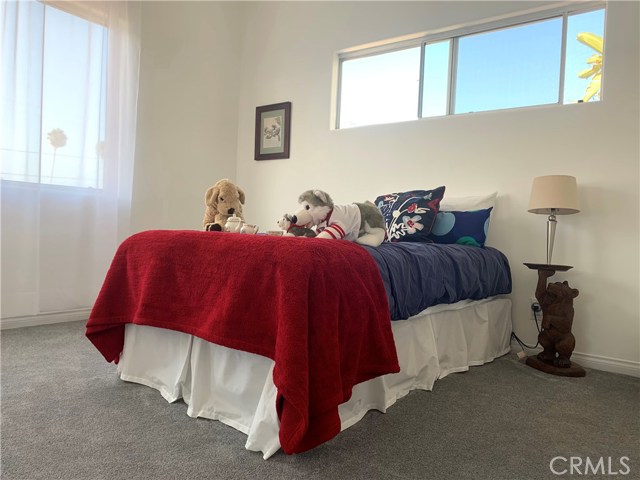 Bright and cheery with window views, this bright and cheery room as all of the upstairs bedrooms (including office) have vaulted ceilings which adds to the comfort and added spaciousness of all these rooms. They are all corner bedrooms which is a rare benefit that is a great feature of this home.