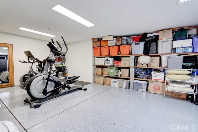 Versatile bonus/storage room area, 14' deep x 21'.6" wide, adjacent to garage.
