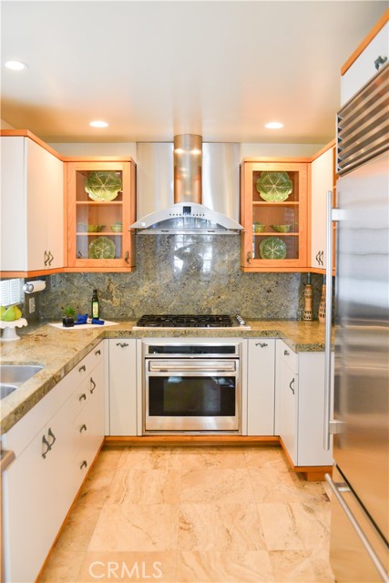 A wonderful kitchen with stone floors and granite counters.