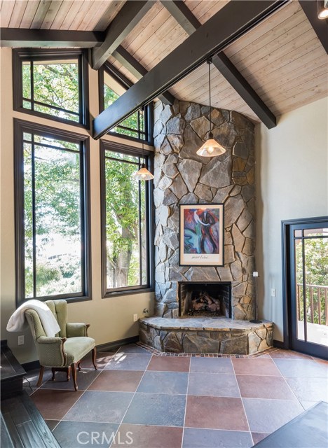 Master bedroom's fireplace, tree top views.