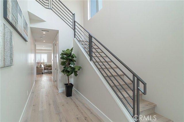 Entry to Home, Stairs on Right, Hallway to Family Room and Kitchen.