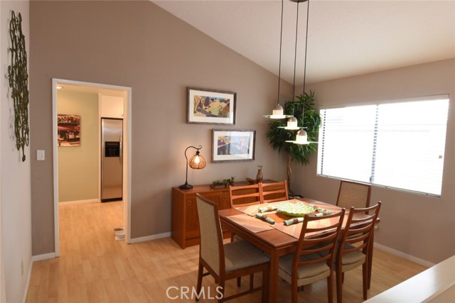 Formal dining room with vaulted ceilings. Conveniently located just off the kitchen.