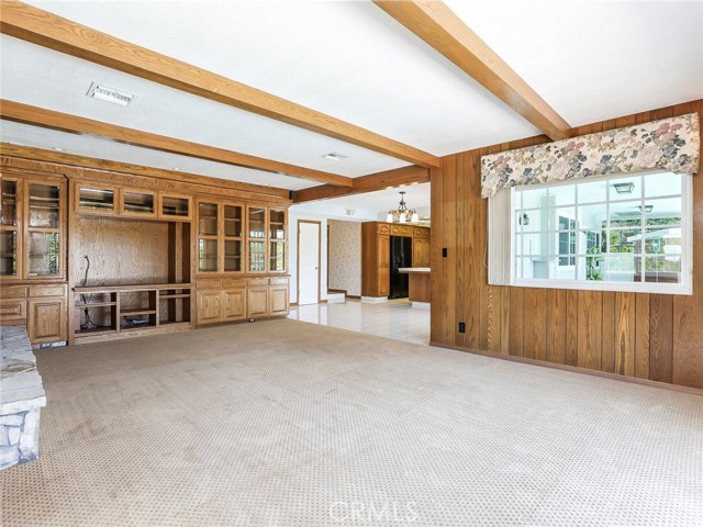Built-in media center in the family room.  Area for TV slides out if you prefer to return to the wet bar.